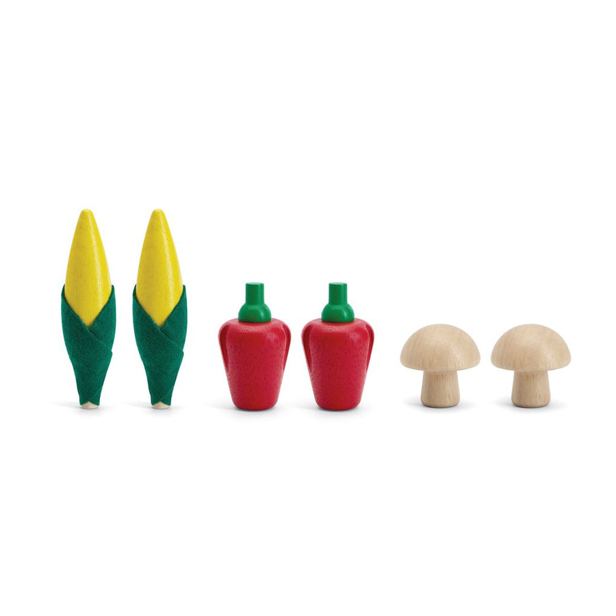 Assortiment de produits frais D (épis de maïs, champignons et poivrons rouges)