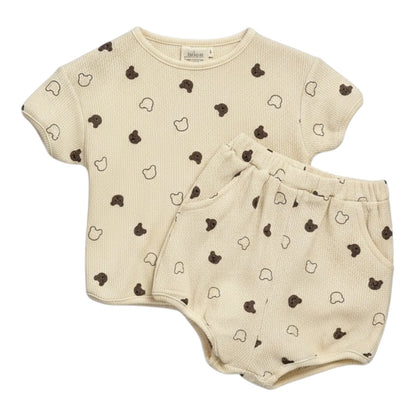 Beige waffle-textured baby top and shorts set with all-over teddy print, displayed flat on a white background.
